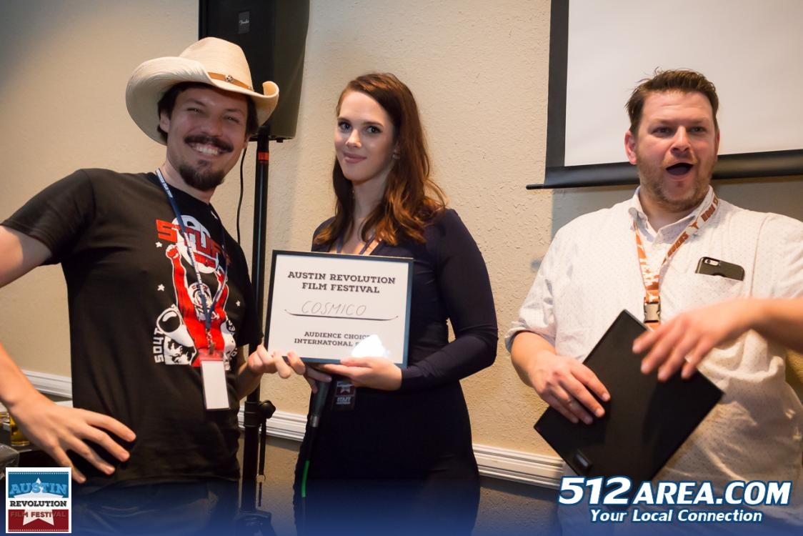 When in Rome: C.J. Lazaretti dons James Christopher's stetson to collect the Audience Choice Award for Best International Short. (Photo: 512area.com)
